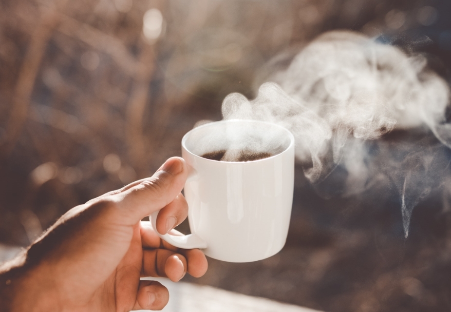 Hot black coffee in a white cup