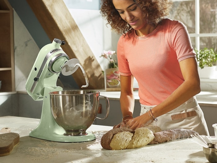 Medium-sized mixing bowl on tilt-head mixer with dough hook making bread
