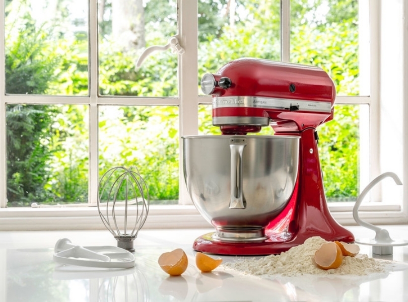 Red mixer with whisk dough hook and paddle attachment