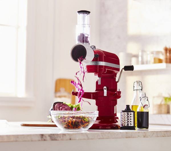 Making shreds for rainbow salad with vegetable slicer and shredder