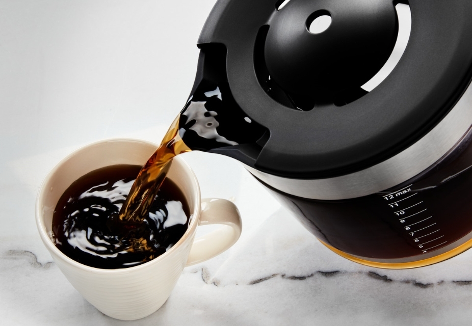 Serving black coffee in white cup