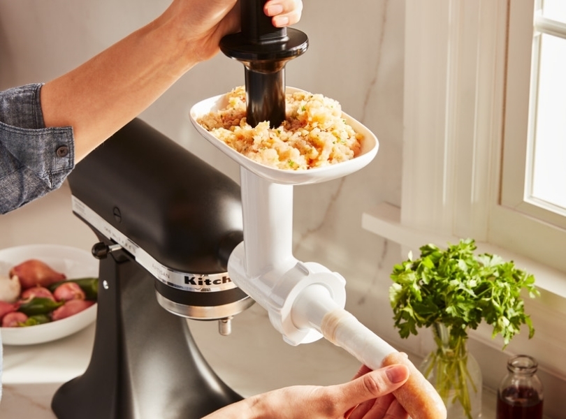 Sausage stuffer attached to a black mixer