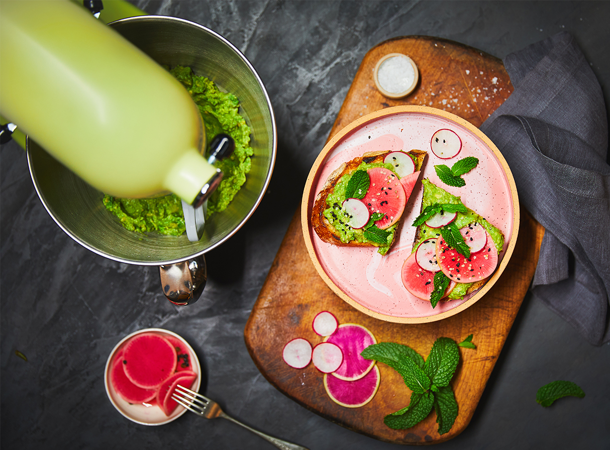 Yellow stand mixer and guacamole and radish toasts