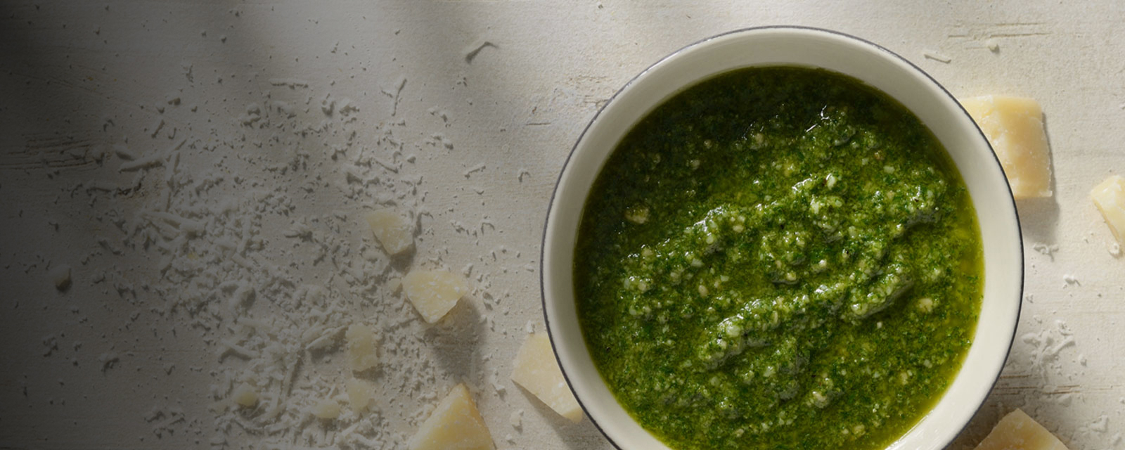 Green pesto sauce with parmesan cheese