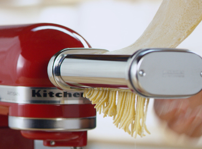 Cutting pasta sheets with pasta cutters to make spaghetti