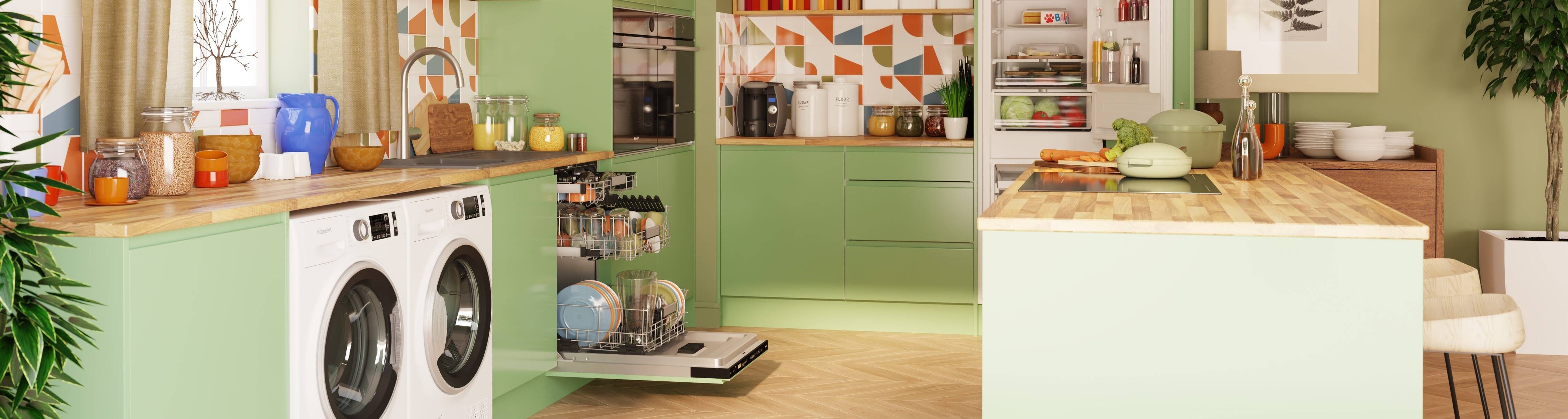 Hotpoint washing machine, tumble dryer, hob, oven, dishwasher, and refrigerator displayed in a green kitchen setting